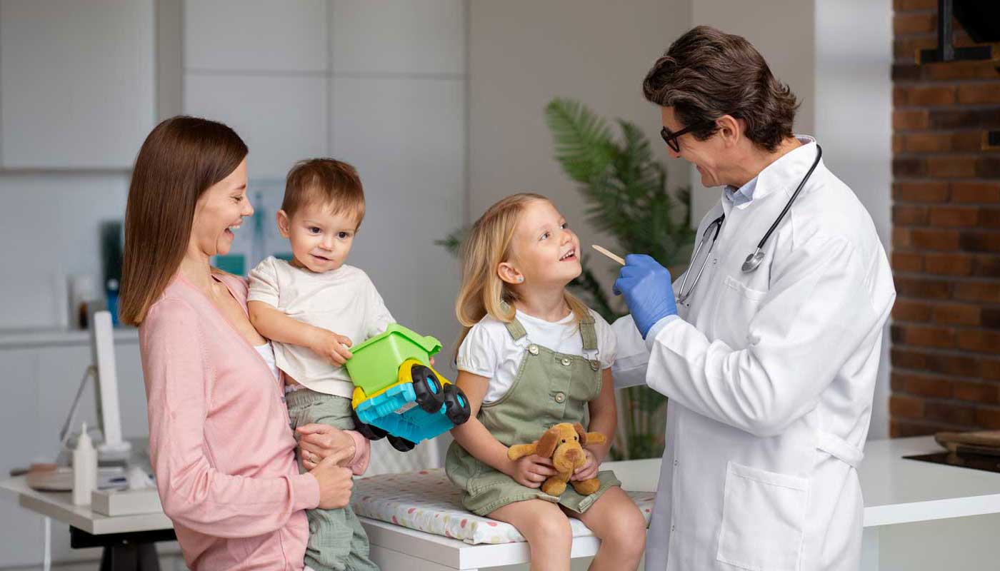 Family doctor providing care to mother and children at Dundas Urgent Care in Mississauga